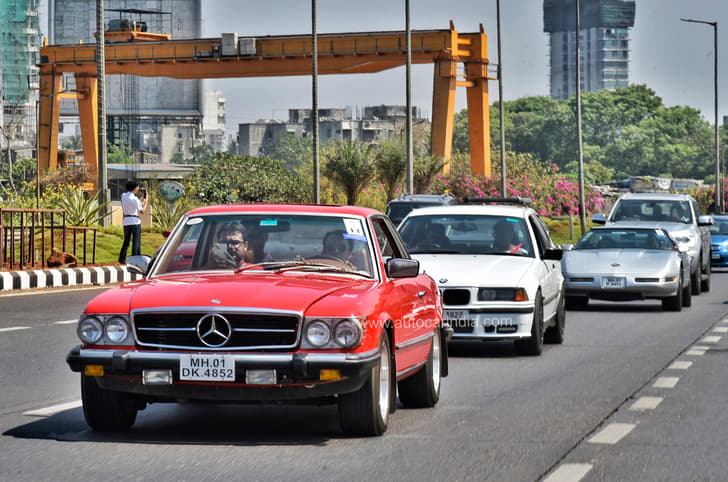 A Mercedes 450 SLC leading a BMW and a Corvette.